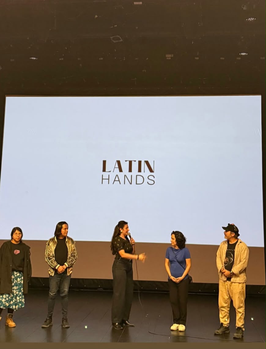 Latin Hands team presenting on stage